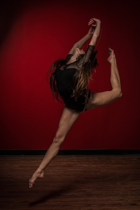 Dancer performs acrobatics.