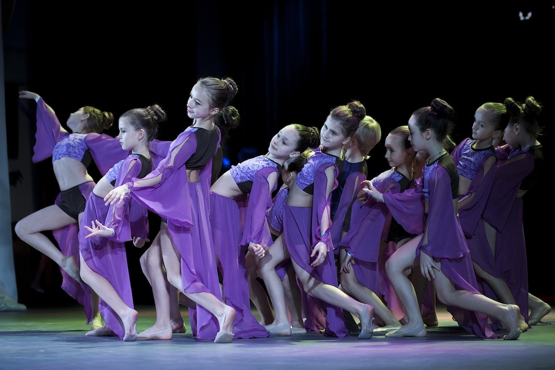 Group of girls performing contemporary dance.